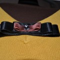 Selects pins with velvet ribbon, lace and Swarovsky.