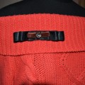 Selects pins with velvet ribbon, lace and Swarovsky.